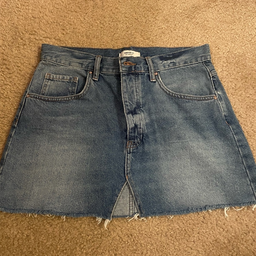Buttons down Jean skirt. Slit in the front. Forever 21